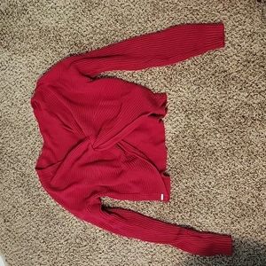 Red crossover sweater